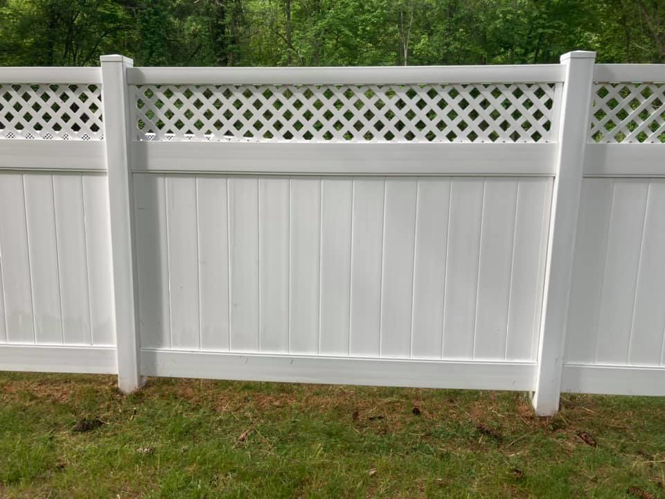 A clean white lattice fence after professional cleaning service by Connecticut Painting Group, Inc in North Haven, CT