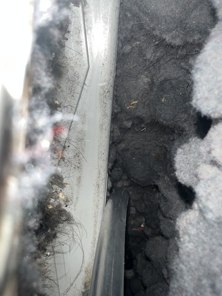 A cleaning tool working inside a heavily lint-filled dryer vent, provided by Elite Vent Cleaning in Bluebird Lane.