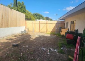 A backyard cleared of debris, showcasing junk hauling services by Impact Environmental Co. in El Cajon, CA.