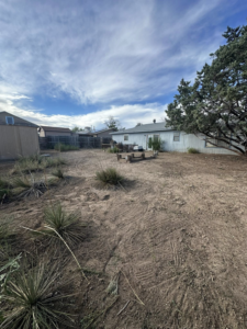 A neatly cleared backyard after land cleanup services by Appleton Residential Services in Rio Rancho, NM.