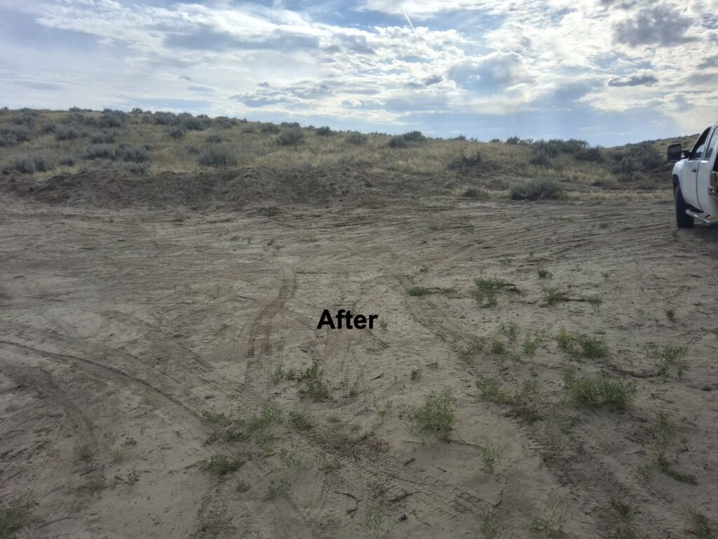 A cleared desert landscape after junk removal, showing the completed work by Rubble Removers LLC in Riverton, WY.