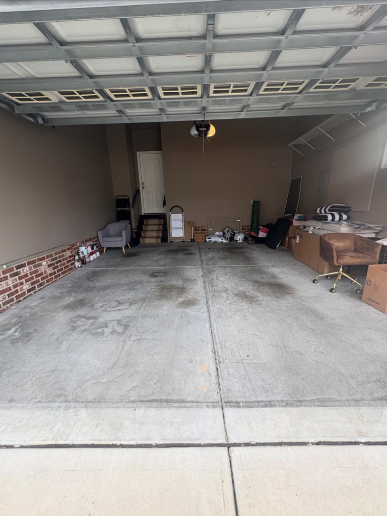 A clean and mostly empty garage after a successful junk removal service by JD Junk Removal in Raleigh, NC.
