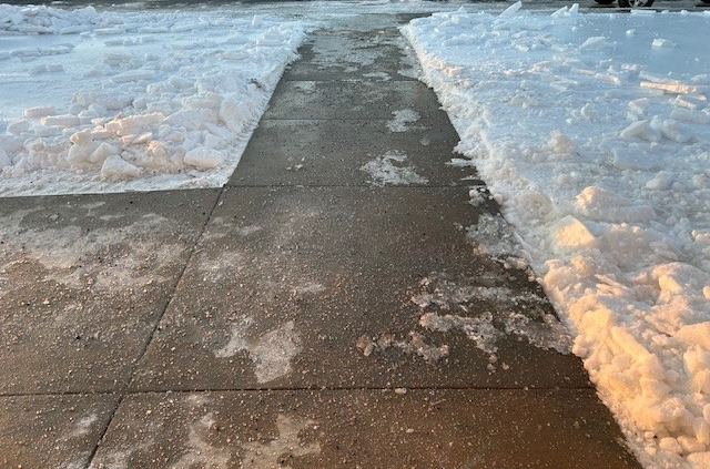 A professionally cleared sidewalk after snow removal by East Coast Services LLC in Baltimore, MD.