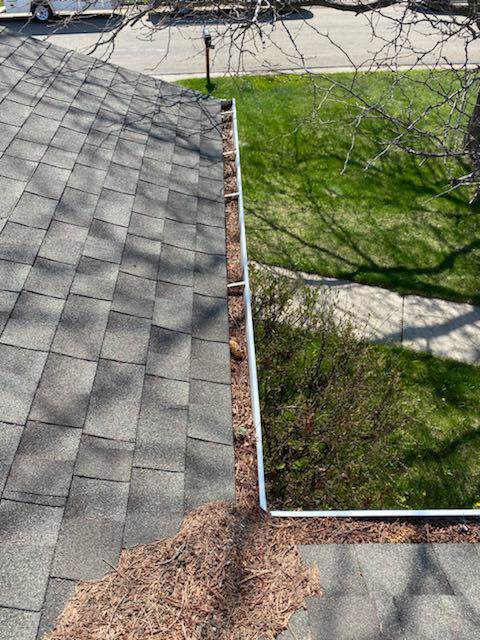 A clogged gutter overflowing with leaves and debris, ready for cleaning by Hey Matt Handyman in Sheridan, WY
