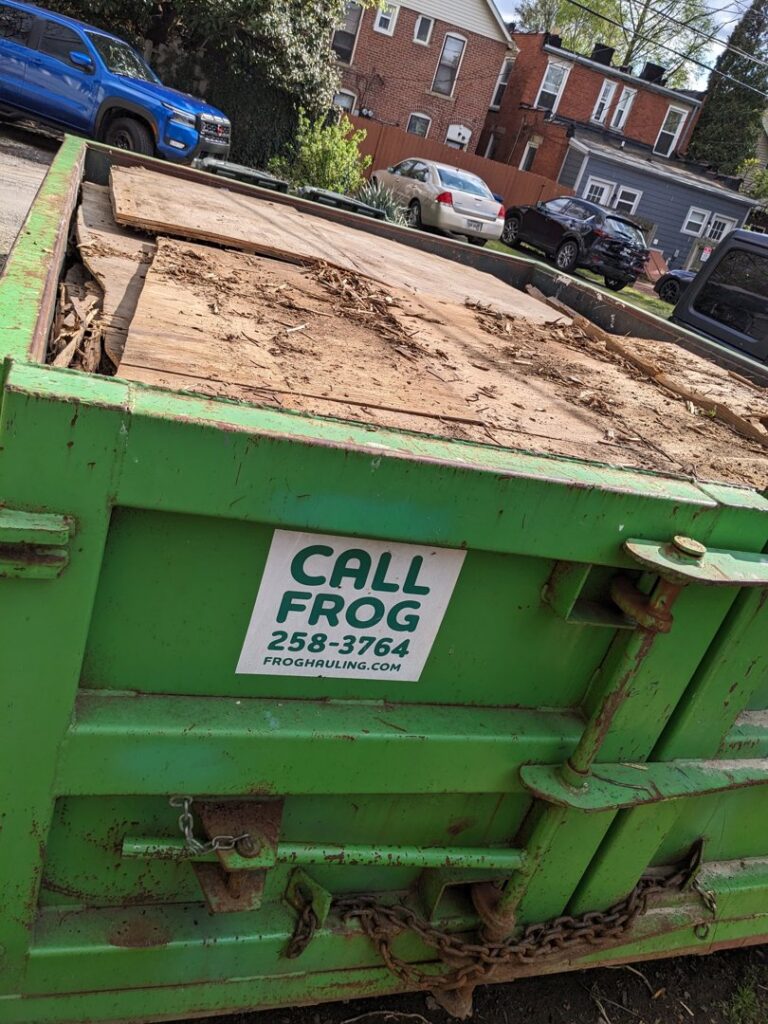 A close-up of a Frog Hauling dumpster filled with general debris from a cleanup project in Columbus, OH.