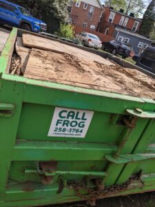 A close-up of a Frog Hauling dumpster filled with general debris from a cleanup project in Columbus, OH.