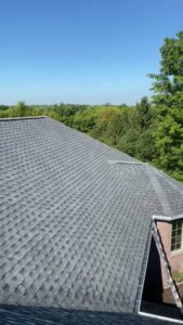 A close-up view of a high-quality grey shingle roof installed by First Contracting Group in Rockford, IL.