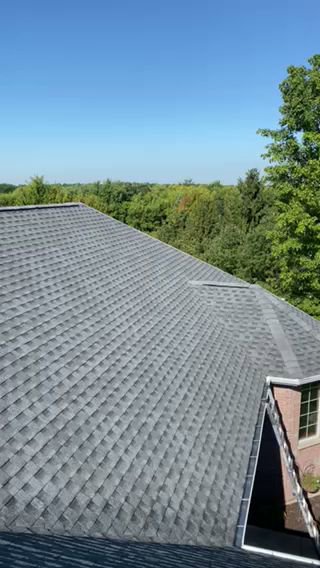 A close-up view of a high-quality grey shingle roof installed by First Contracting Group in Rockford, IL.