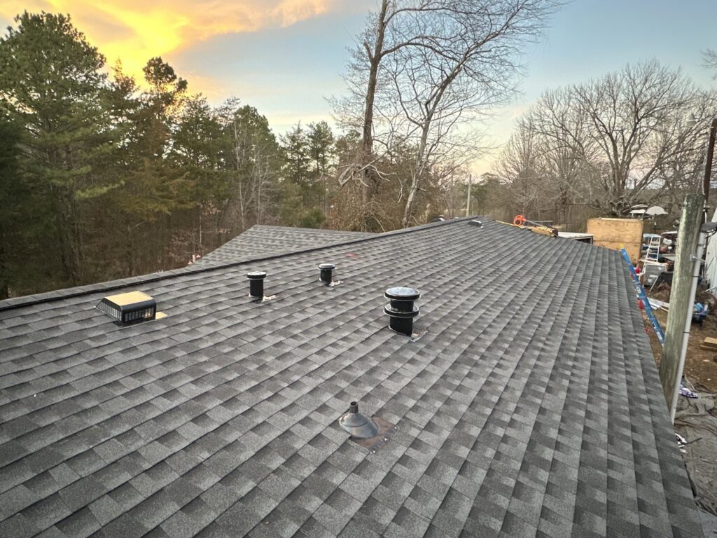 A close-up view of a newly installed dark gray shingle roof, showcasing quality craftsmanship by Northcross Restoration Inc in Memphis, TN.
