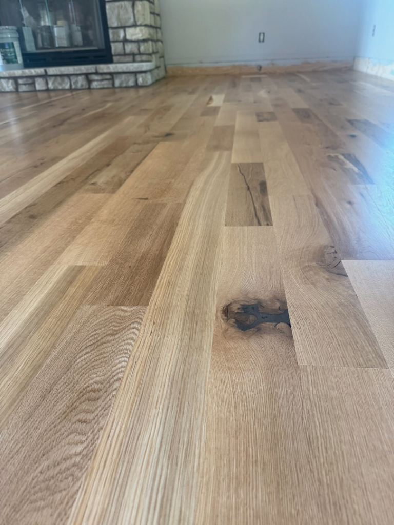 A close-up view of a beautifully newly finished hardwood floor installed by Cordell Hardwood Flooring in Lexington, KY.