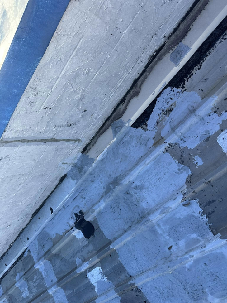 Close-up of roof seam sealant application by Knight Construction Services in Brick, NJ.