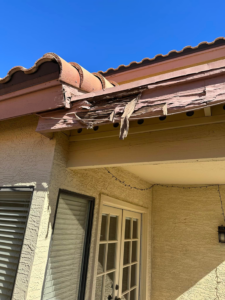 Close-up of severely damaged wood soffit and fascia needing repair by Basevi Home Repair LLC in Gilbert, AZ