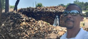 A close-up view of neatly stacked firewood, demonstrating the quality of wood from Personal Touch Tree Service in Dallas, TX