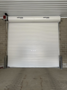 A fully closed Raynor commercial roll-up door installed by Gateway Door and Contracting in House Springs, MO.