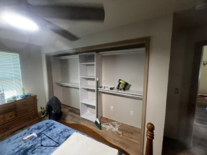 New closet shelving and hanging rods being installed by E&D Lozano Handyman in Caldwell, ID.