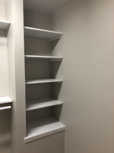 Newly installed white closet shelving by Lee's Painting in Northbrook, IL