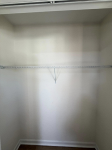 A single wire shelf installed in a closet, showcasing handyman services by HandyWorx Home Services LLC in Kenna, WV.
