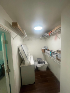 A closet featuring newly installed wire shelving and renovation materials by Done Right Construction in Johnston, IA.