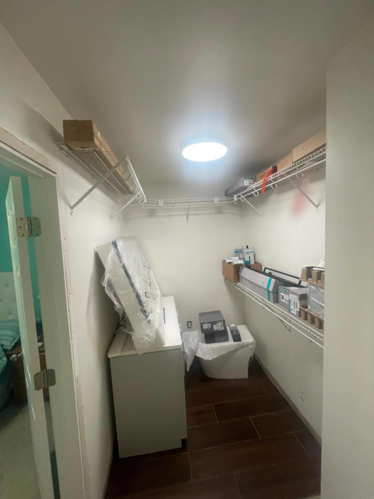 A closet featuring newly installed wire shelving and renovation materials by Done Right Construction in Johnston, IA.