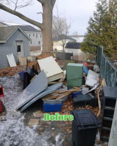 A cluttered backyard filled with various junk items before a cleanup by EcoClear Waste Management Solutions in Aurora, CO.