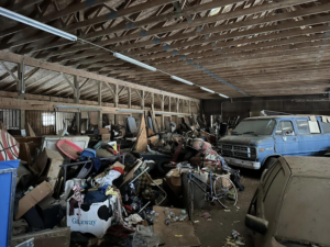 A heavily cluttered barn filled with junk, ready for general junk removal by White Dumpster in Alliance, OH.