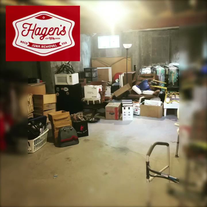A cluttered basement filled with boxes and various items, awaiting junk removal services from Hagen's Junk Removal in Fort Collins, CO.