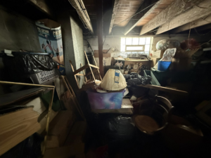A cluttered basement filled with various items, showing a space ready for junk removal by The Best Junk Removal in Columbia Station, OH.