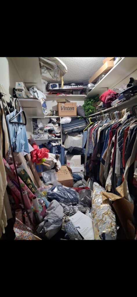 A cluttered closet overflowing with clothes and items, ready for cleanout by T-Rex Service LLC in Cheyenne, WY.