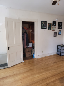 A cluttered closet and dirty room needing a cleanout service from Paul's Trash in East Montpelier, VT.