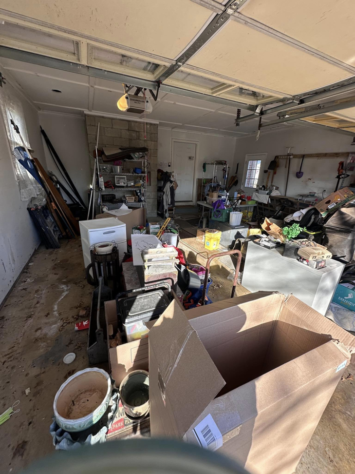 A cluttered garage filled with various items and appliances, awaiting junk hauling by 302-Rid-Junk in Wilmington, DE.