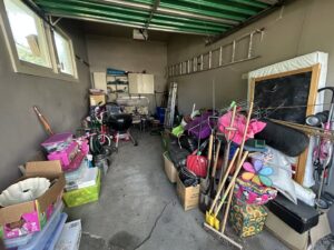 A cluttered garage filled with various items, representing a typical scene before junk removal by KJ Haul Away Junk Removal in Cedar Rapids, IA.