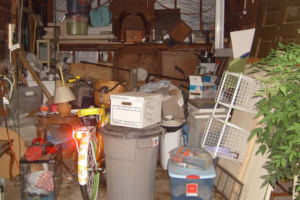 A heavily cluttered garage or storage space requiring a cleanout service from Avery's Junk Removal & Hauling in Trenton, MI.