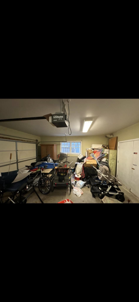 A cluttered garage filled with bicycles, boxes, and miscellaneous items, awaiting junk removal by Pop's Pickup Junk & Trash Removal in Roswell, GA.