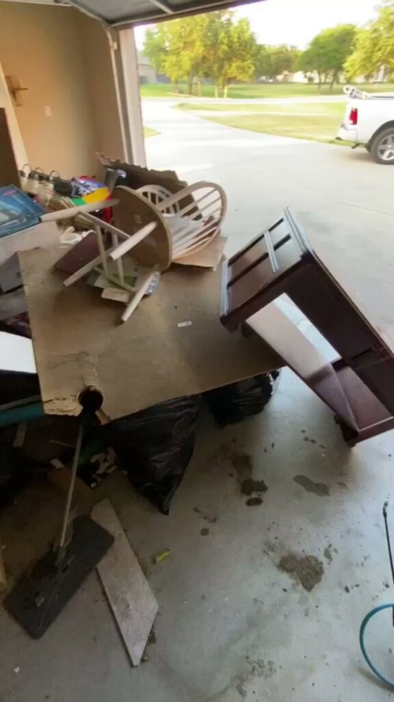 A cluttered garage filled with various household junk, ready for removal by JB'S Junk Removal in Justin, TX.