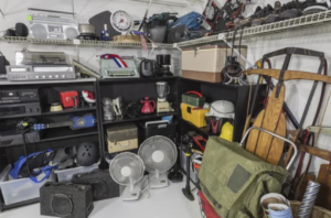A cluttered garage or storage area with various items on shelves, ready for a cleanout by Fernley Fast Haul in Fernley, NV
