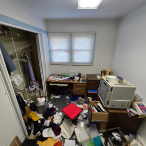 A cluttered office or storage room before a cleanout and organization service by 1st State's Finest LLC, your handyman in Middletown, DE.