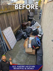 A cluttered outdoor path filled with trash bags, boxes, and debris before junk removal by All American Junk Removal And Demo LLC in Citrus Heights, CA.