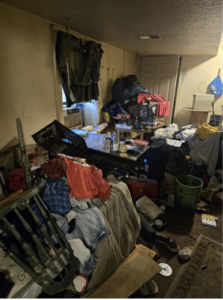 A cluttered room before a clean-out or renovation project by A&B Snow, Mow, and Contracting in Sioux City, IA.