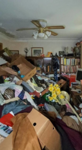 A heavily cluttered room filled with various items, showing a typical scene before a junk removal job by Junken Monkeys Hauling Company in Scranton, PA.