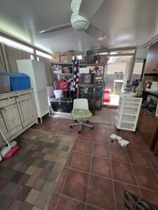 A cluttered room filled with boxes and furniture, ready for junk removal by Sac Junk in Rancho Cordova, CA