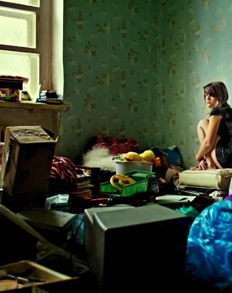 A heavily cluttered room with various items, depicting a hoarding cleanup or junk removal job by Affinity Bio Solutions in Phoenix, AZ.