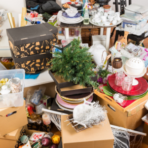 A heavily cluttered room filled with household items, ready for general junk removal by The Dumpster Guy in Webster, MA.