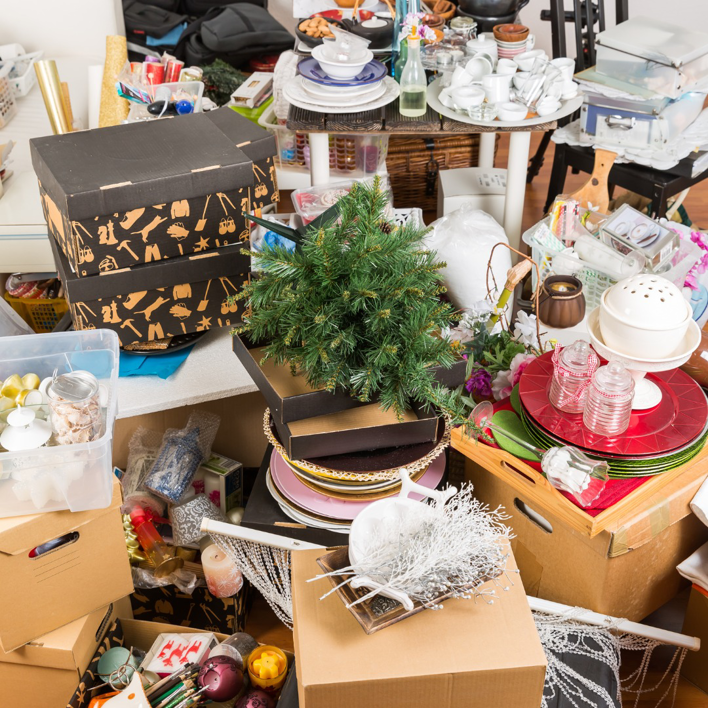 A heavily cluttered room filled with household items, ready for general junk removal by The Dumpster Guy in Webster, MA.
