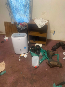 Cluttered room with a dehumidifier and items, for junk removal by Adept Junk Removal Services LLC, Tacoma.
