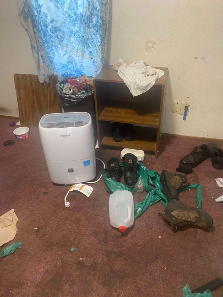 Cluttered room with a dehumidifier and items, for junk removal by Adept Junk Removal Services LLC, Tacoma.