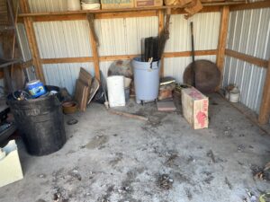 A cluttered shed filled with old items and debris, ready for a cleanout service by DC'S Removal Service in Neelyville, MO.