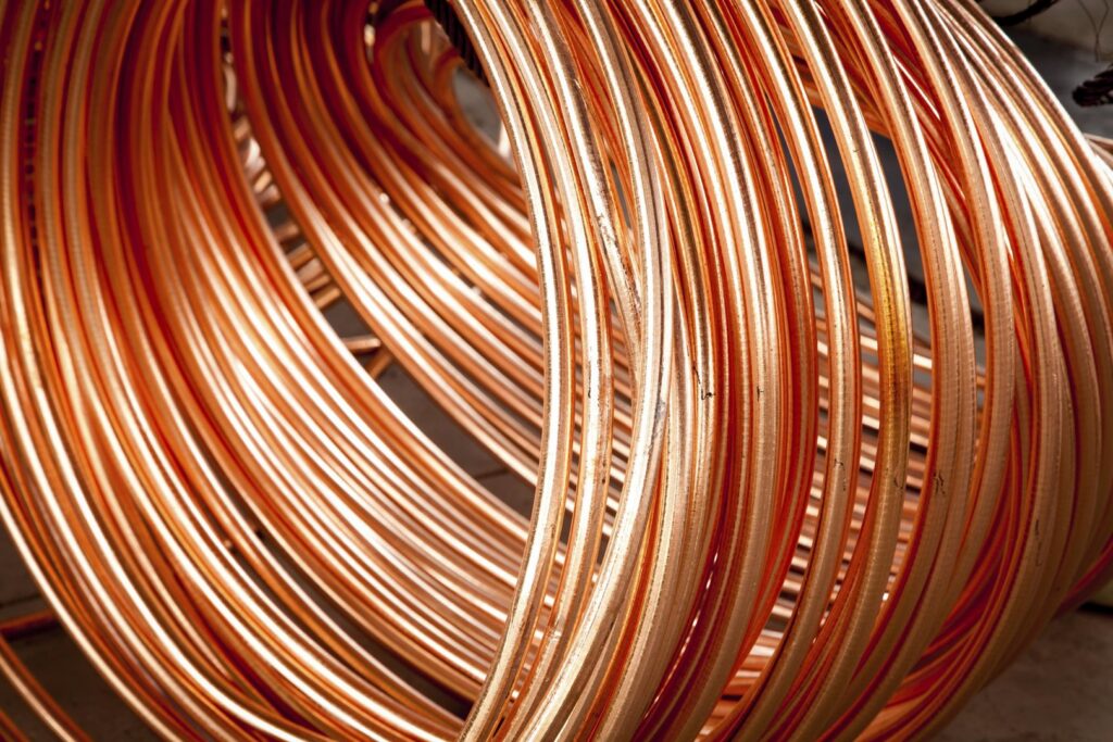 A large coil of copper tubing, a common item for scrap metal recycling at RZR Mechanical LLC in Phoenix, AZ.