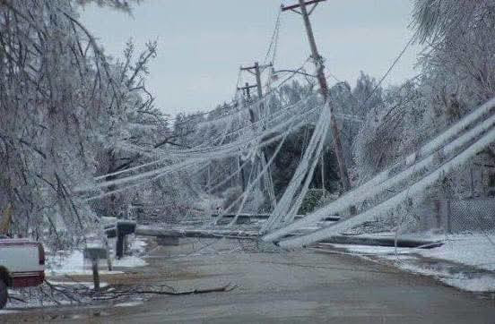 Collapsed power lines and poles due to ice-laden trees after a storm, a job for Tim's Tree Service & Landscaping in Milan, TN.