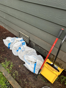 Collected pet waste bags and scooping tools for Pet Peeve Poop Scoop in Olympia, WA