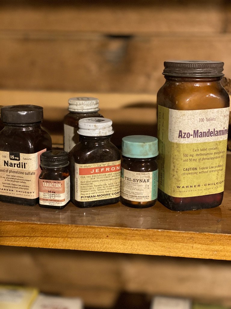 A collection of old medicine bottles, representing hazardous waste for MLi Environmental in South Portland, ME.